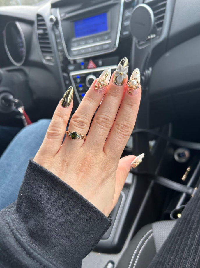 The design is exactly like on the pictures and the nails hold up really well, although I did glue them on with regular nail glue, so I can‘t speak for the adhesive that comes with the nails. They look professionally done and I love them a lot.